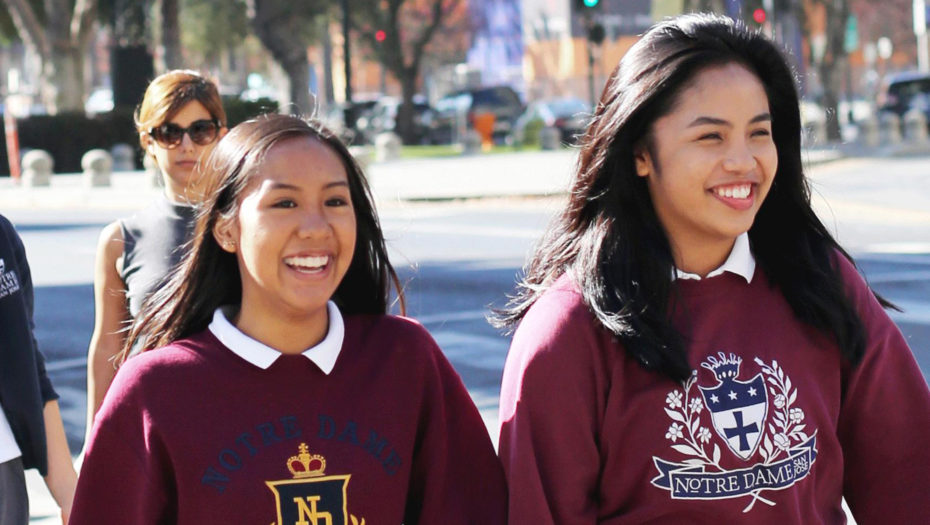 highschool girls smiling and walking together