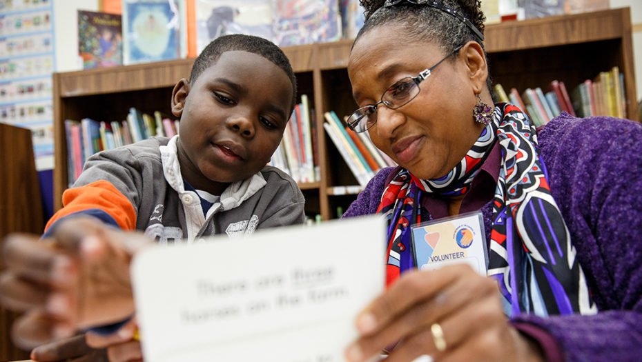 children rising cover volunteer helping student