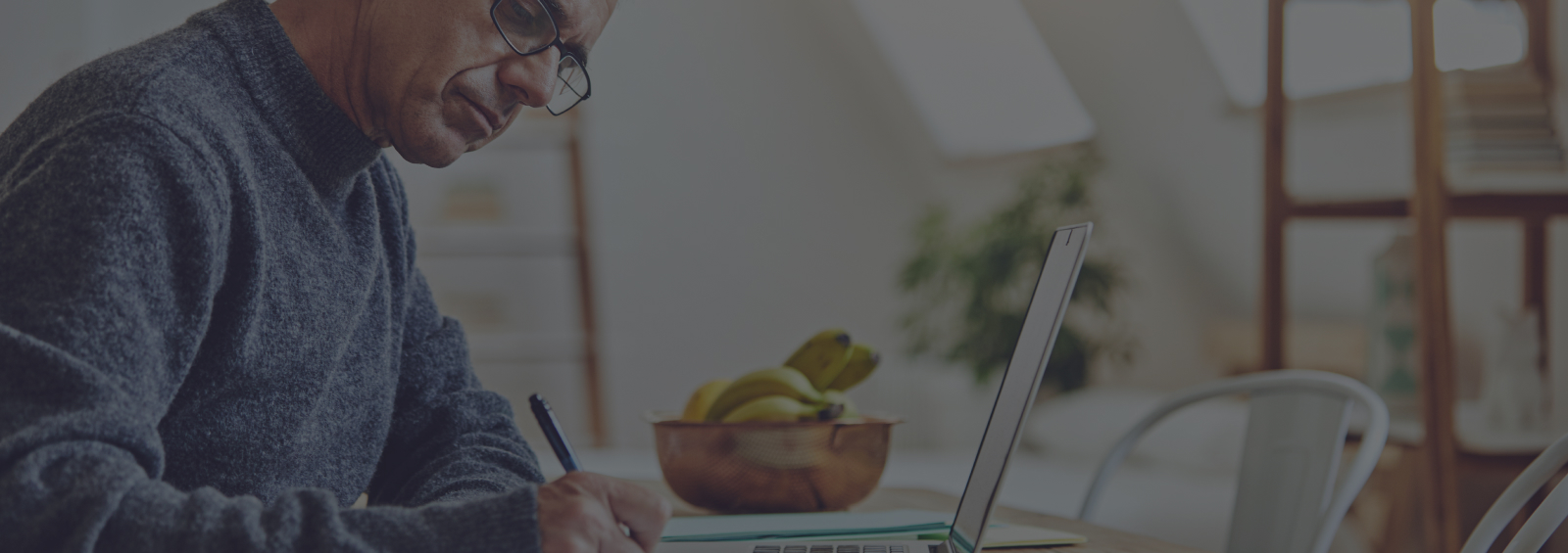 quicken header man writing notes